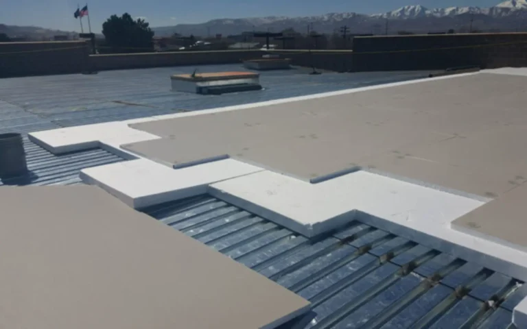EPS flute fill strips and tapered insulation pieces laid on a metal roof deck
