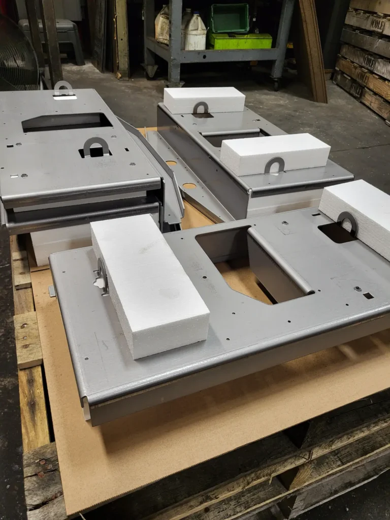 White EPS foam blocks beside machined packaging parts
