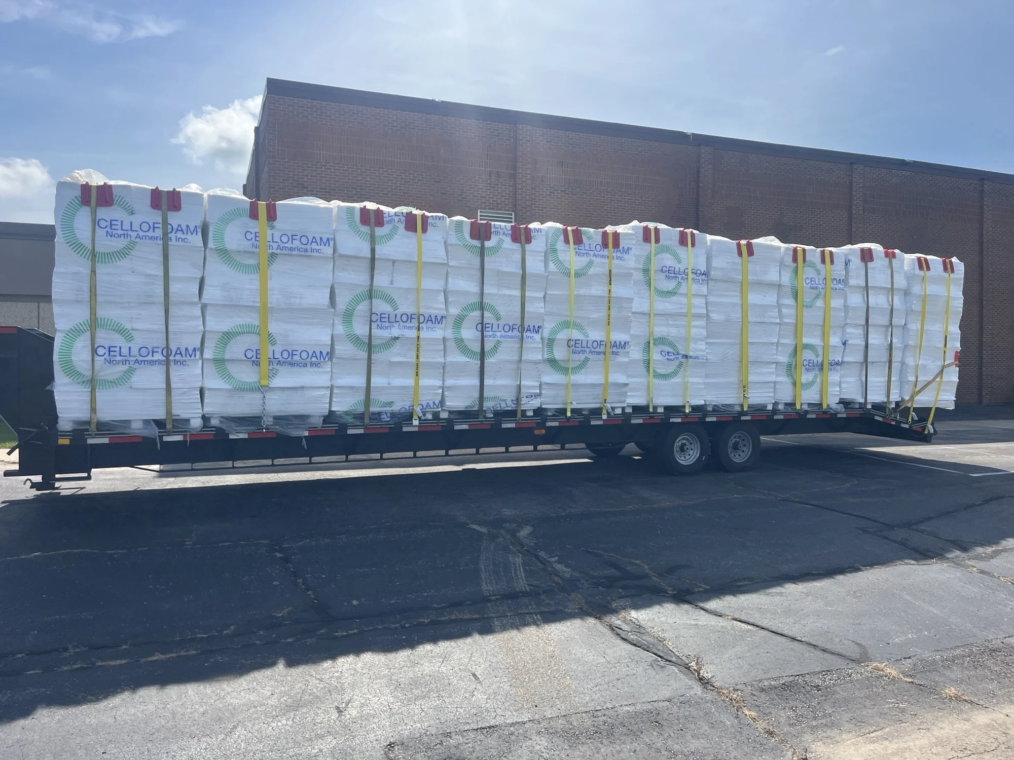 Flatbed trailer loaded with wrapped EPS foam blocks